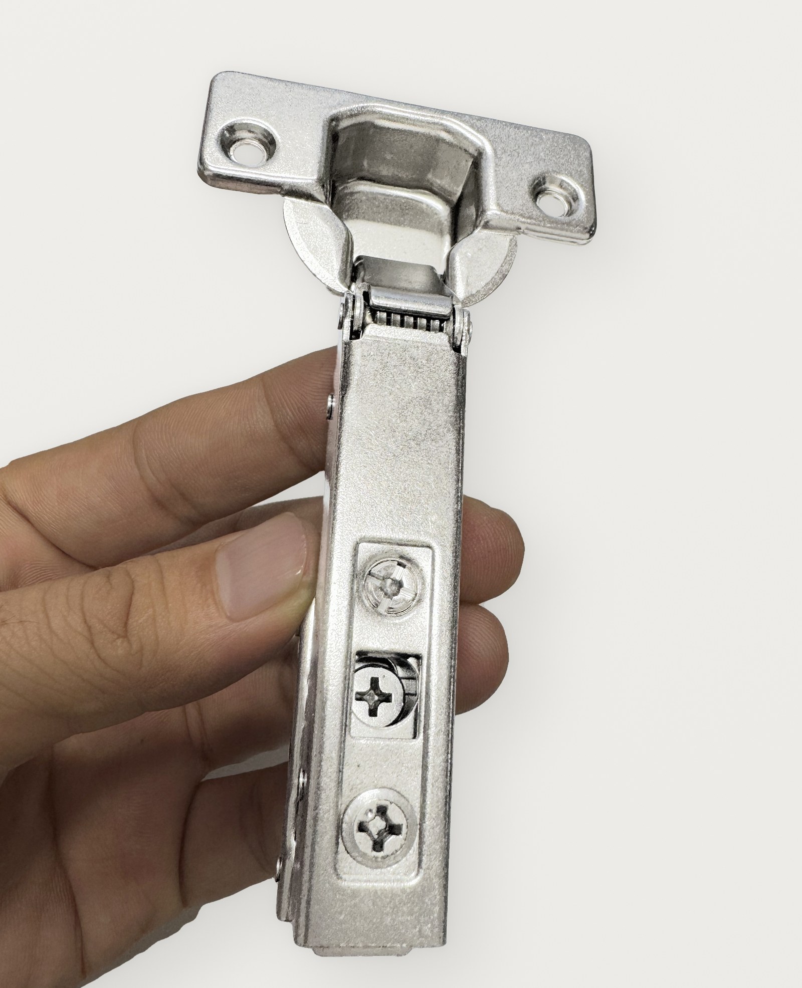 A Terq concealed hinge held in hand